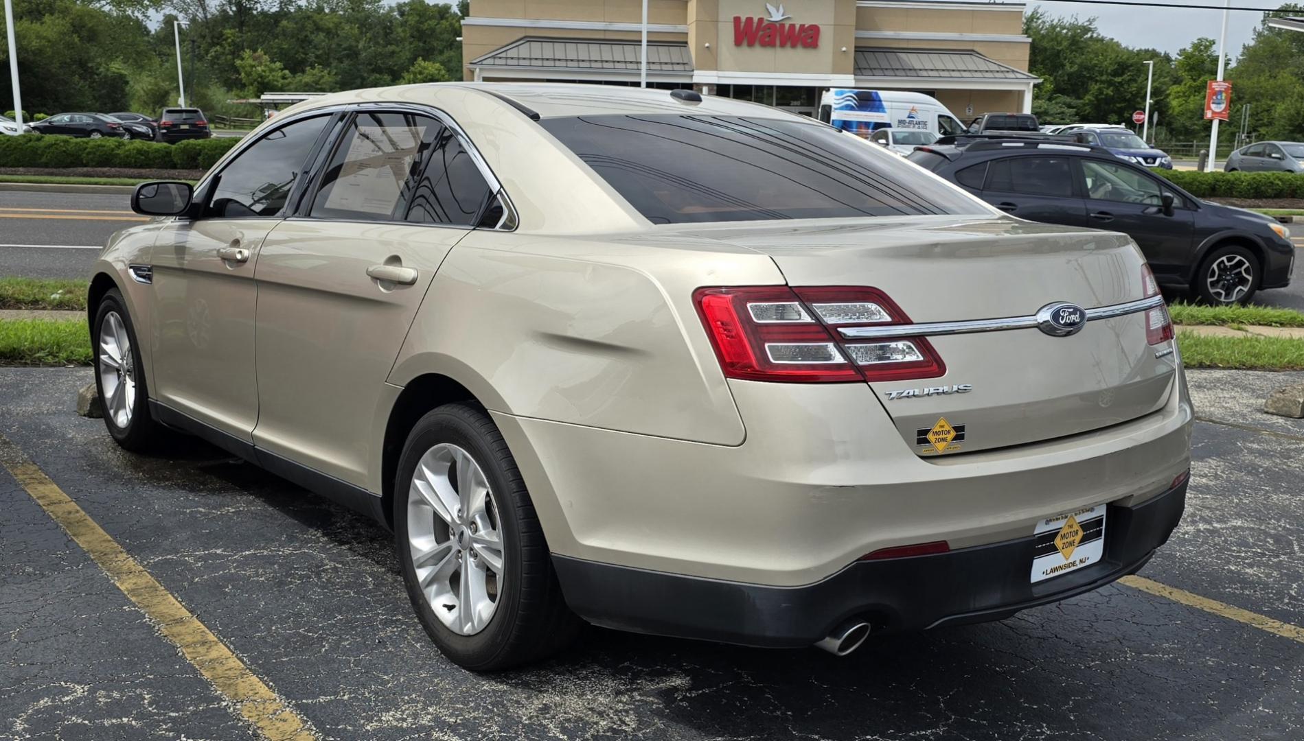 2017 Tan Ford Taurus SE (1FAHP2D85HG) with an V6, 3.5 Liter engine, Auto, 6-Spd w/SelShft transmission, located at 341 N White Horse Pike, Lawnside, NJ, 08045, (856) 262-9500, 39.855621, -75.027451 - Photo#2